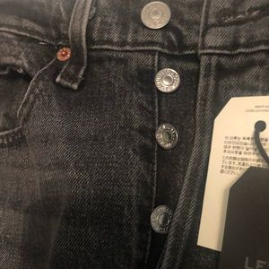 Distressed black skinny jeans